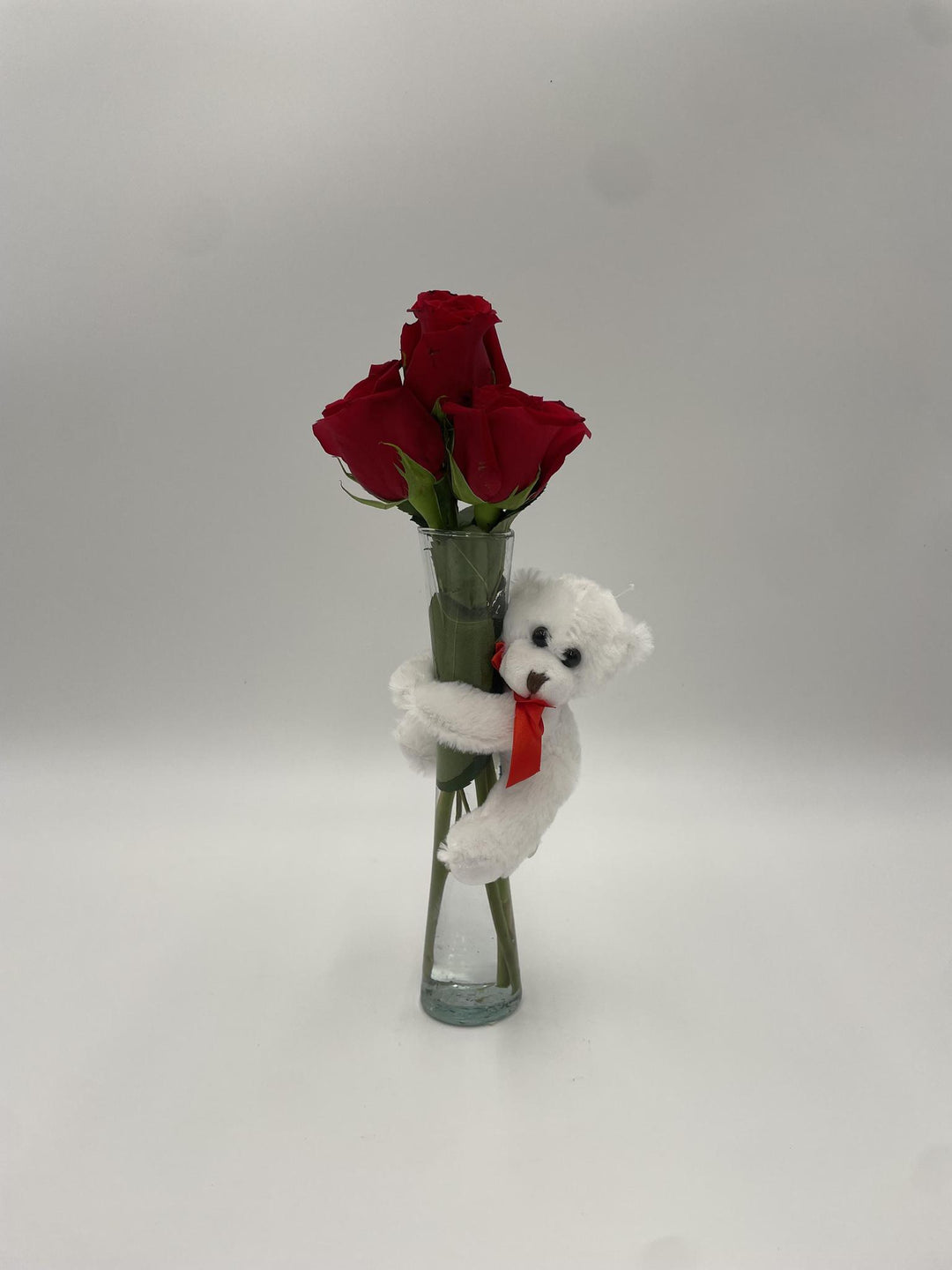 Three Red Roses with Clear Vase & Vase Hugging Bear